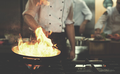 Image showing Chef doing flambe on food