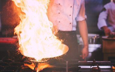 Image showing Chef doing flambe on food