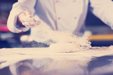 Image showing chef hands preparing dough for pizza