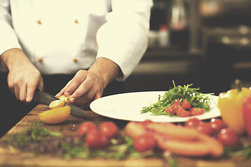 Image showing chef serving vegetable salad