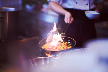 Image showing Chef doing flambe on food