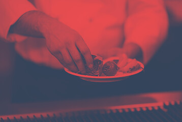 Image showing chef hands cooking grilled salmon fish