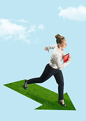 Image showing Businesswoman holding laptop walking on graphic stair, start up business concepts.