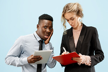 Image showing Serious businesswoman and colleague in the office.