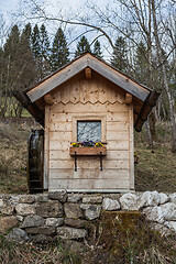 Image showing Garden shed with water wheel