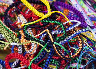 Image showing Handmade woven bracelets background