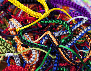 Image showing Handmade woven bracelets background