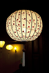 Image showing White Chinese lantern over black background