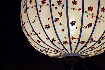 Image showing White Chinese lantern over black background