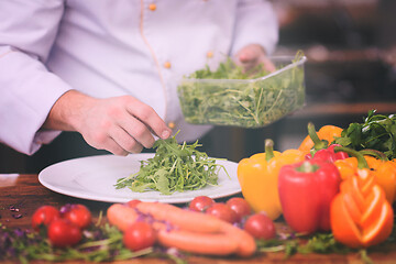 Image showing chef serving vegetable salad