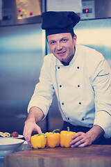 Image showing chef holding fresh peppers