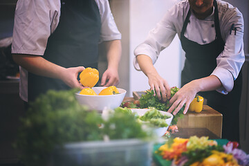 Image showing team cooks and chefs preparing meals