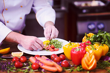 Image showing chef serving vegetable salad