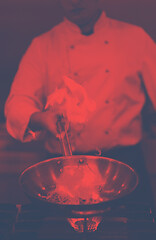 Image showing Chef doing flambe on food