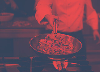 Image showing chef flipping vegetables in wok