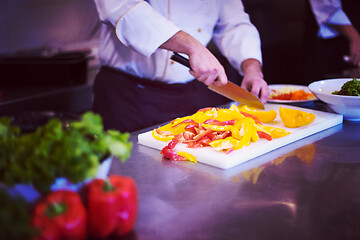 Image showing Chef cutting fresh and delicious vegetables