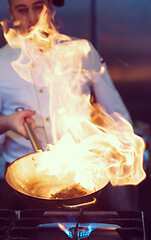 Image showing Chef doing flambe on food