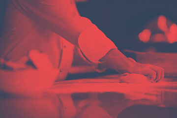 Image showing chef hands preparing dough for pizza