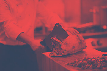 Image showing chef cutting big piece of beef