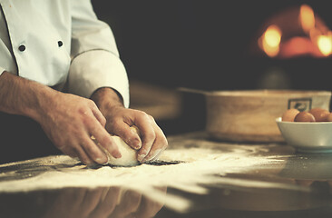 Image showing chef hands preparing dough for pizza