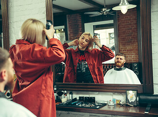 Image showing Client during beard shaving in barber shop