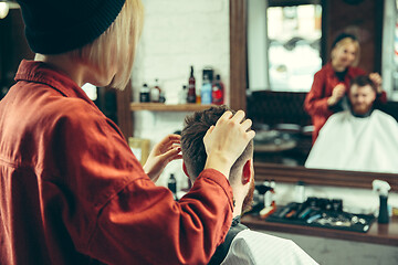 Image showing Client during beard shaving in barber shop