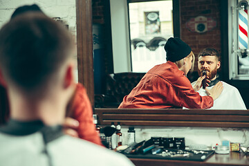 Image showing Client during beard shaving in barber shop