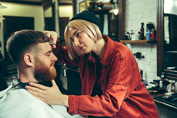 Image showing Client during beard shaving in barber shop