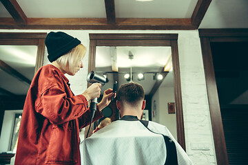 Image showing Client during beard shaving in barber shop