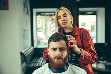 Image showing Client during beard shaving in barber shop