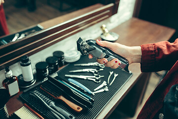 Image showing Female barber in barber shop