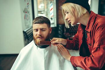 Image showing Client during beard shaving in barber shop