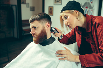 Image showing Client during beard shaving in barber shop