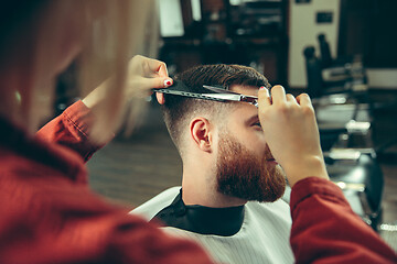 Image showing Client during beard shaving in barber shop