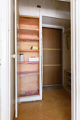 Image showing Old wardrobe in the interior of an apartment hallway with an outdated poor interior