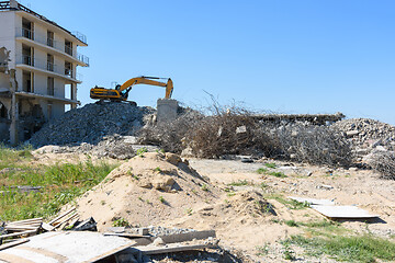 Image showing Excavator with hydraulic hammer dismantling a building