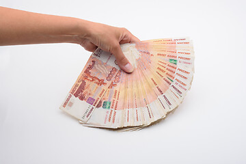 Image showing A hand fanned out a bundle of Russian five-thousandth bills