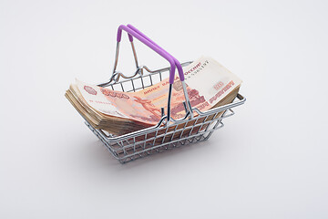 Image showing A large bundle of Russian bills is in the grocery basket