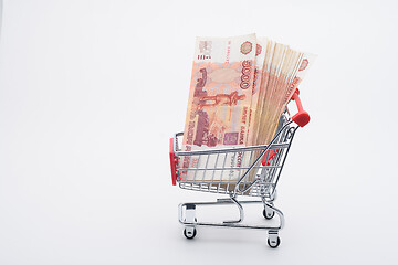 Image showing There is a bundle of Russian money in the grocery cart