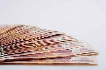 Image showing Bud of banknotes on a white background fanned out