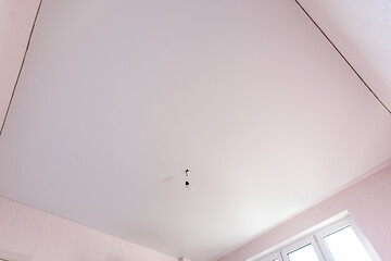 Image showing Stretch matte white ceiling in the interior of a square room