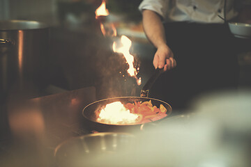 Image showing Chef doing flambe on food