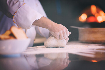 Image showing chef hands preparing dough for pizza