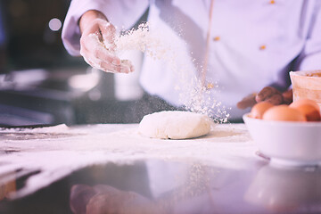 Image showing chef hands preparing dough for pizza