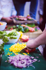 Image showing Chef hands cutting fresh and delicious vegetables