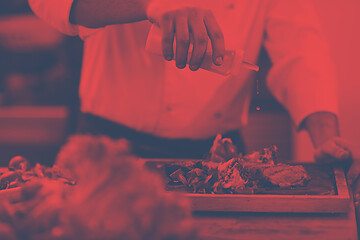 Image showing Chef finishing steak meat plate