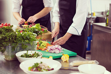 Image showing team cooks and chefs preparing meals