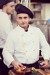 Image showing Chef serving beef steak