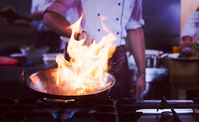 Image showing Chef doing flambe on food