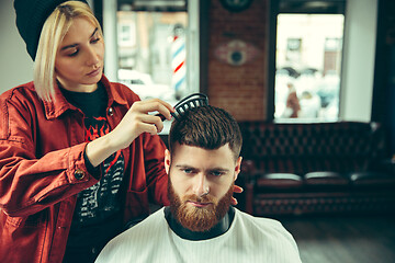 Image showing Client during beard shaving in barber shop